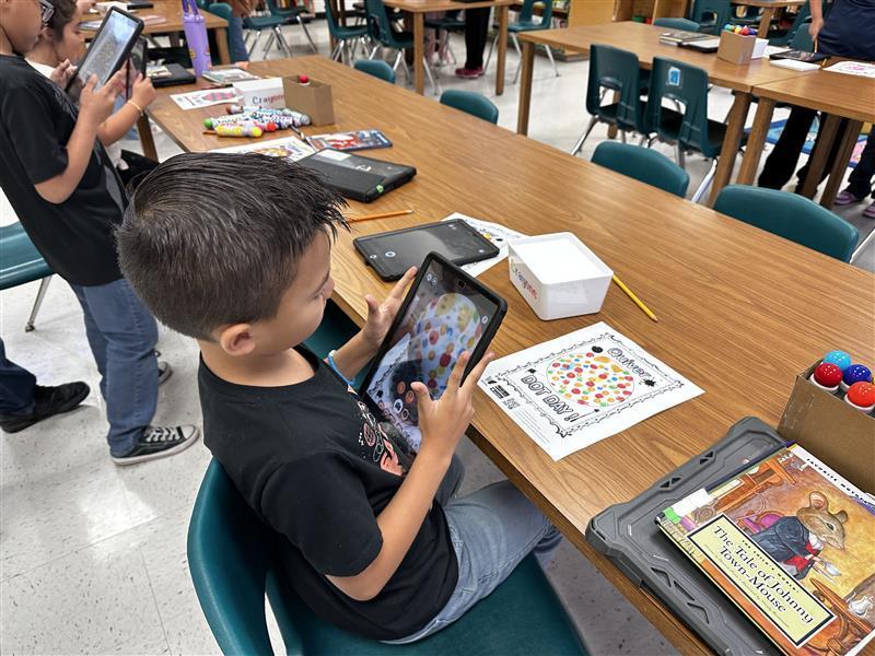 Student working on dot day activity.
