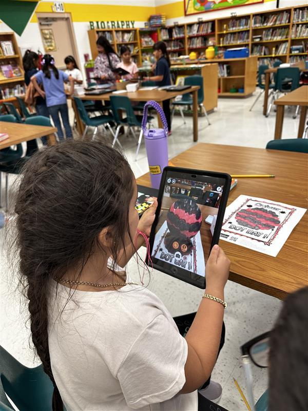 Student working on dot day activity.