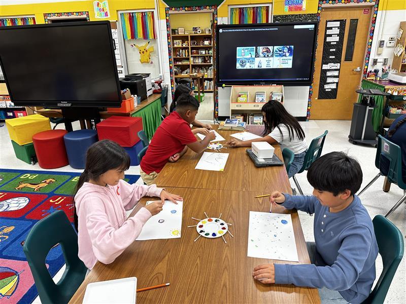 Student working on dot day activity.
