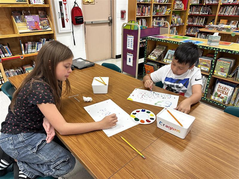 Student working on dot day activity.