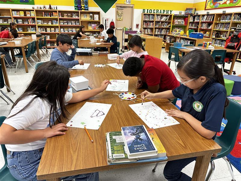 Student working on dot day activity.