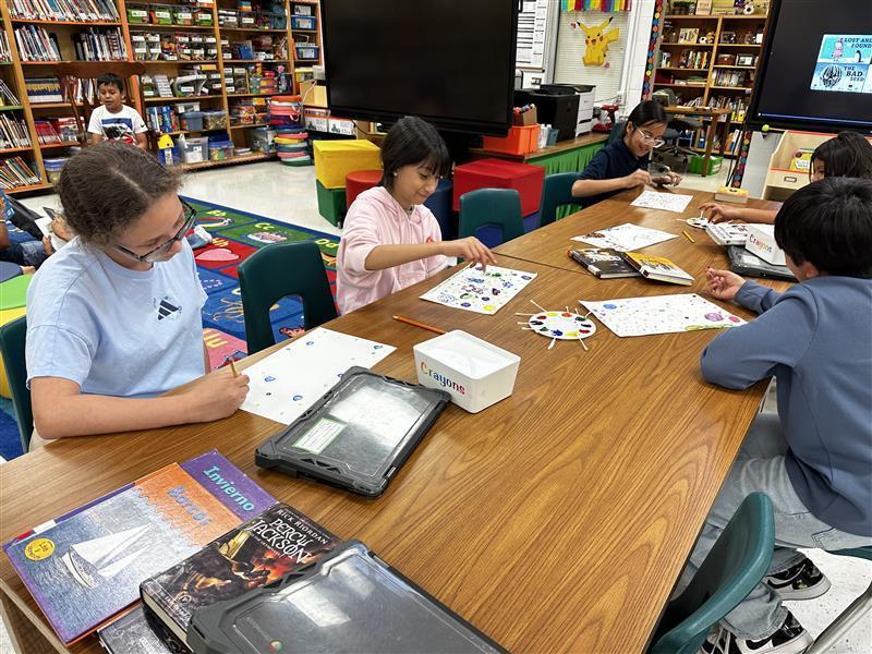 Student working on dot day activity.