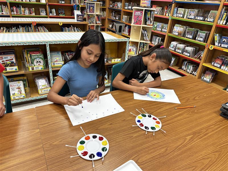 Student working on dot day activity.
