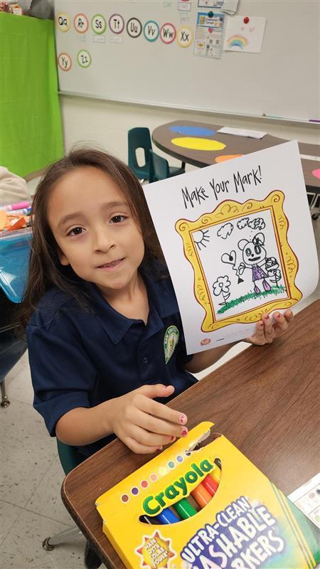 Kid posing with art.