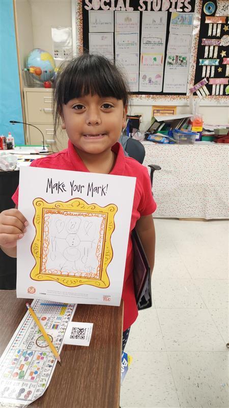 Kid posing with art.