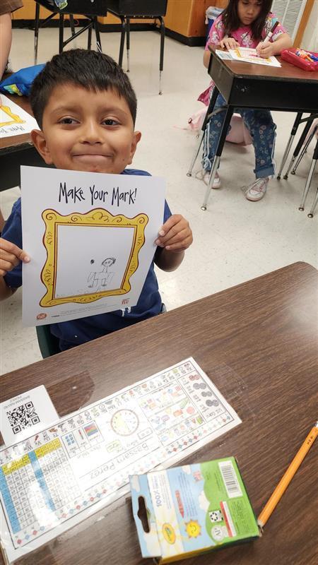 Kid posing with art.