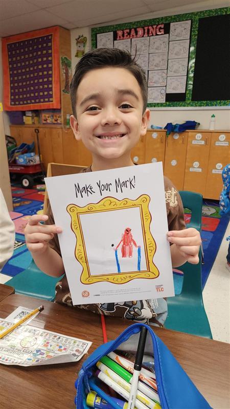 Kid posing with art.