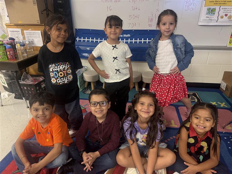 Kids posing with dot day attire.