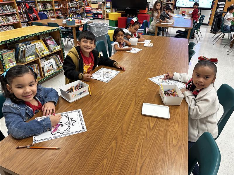 Students posing at library.