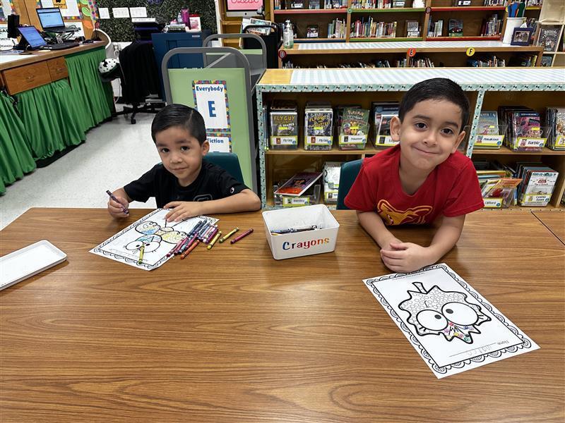 Students posing at library.