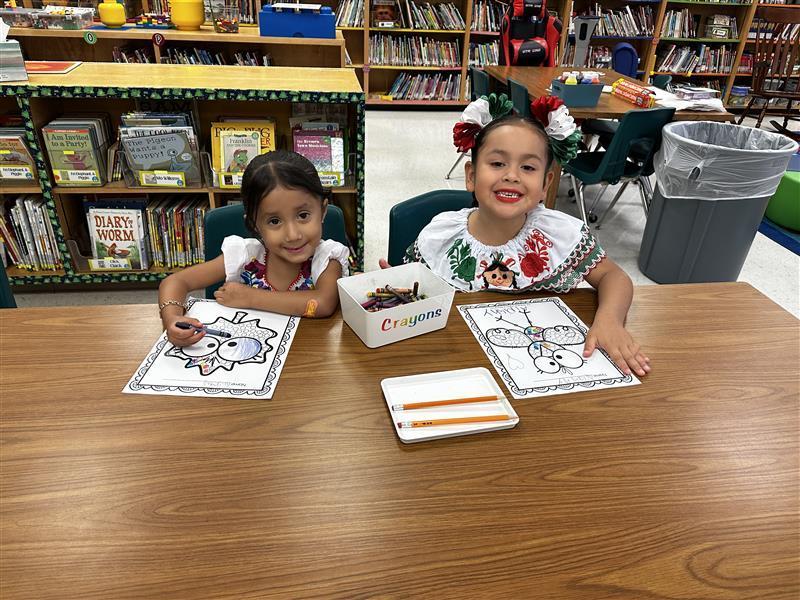 Students posing at library.