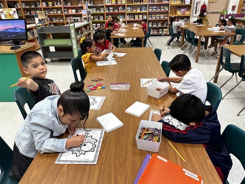 Students posing at library.