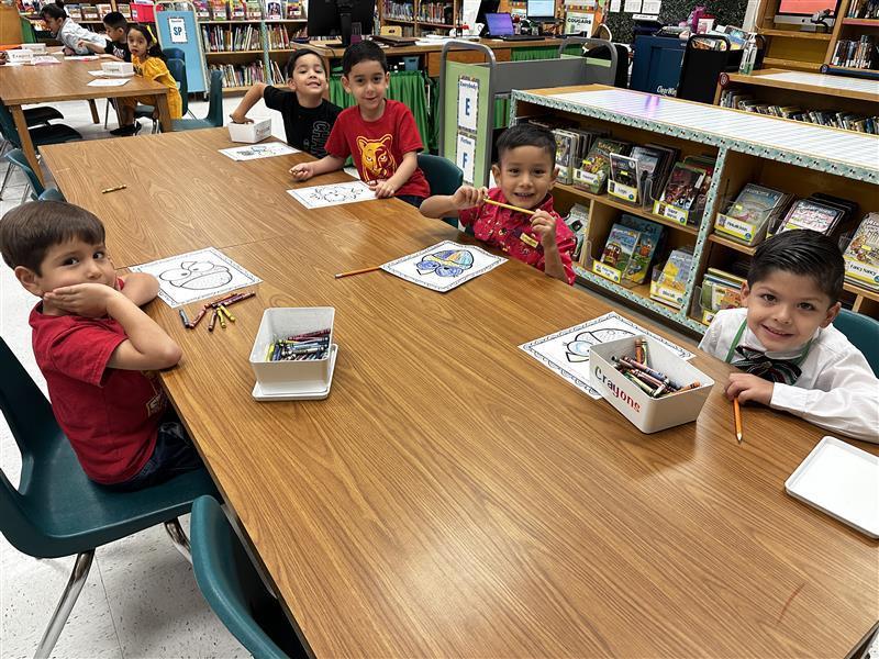 Students posing at library.
