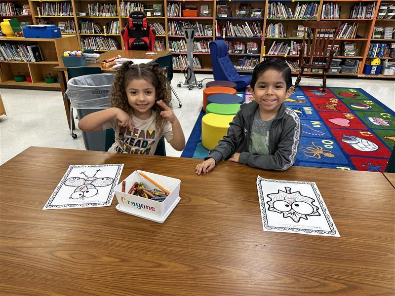 Students posing at library.
