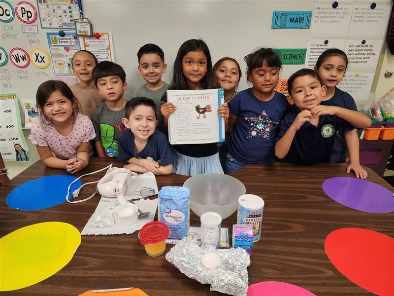 Kids posing with story.