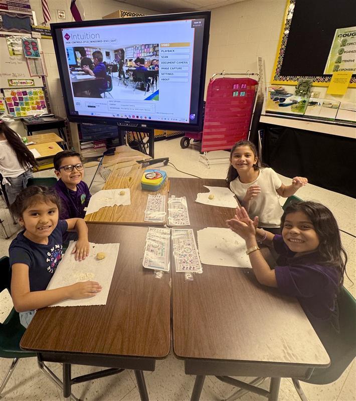 Kids working with dough.
