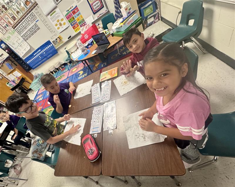 Kids working with dough.