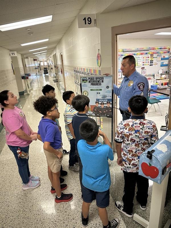 Sgt. Balli talking to kids.