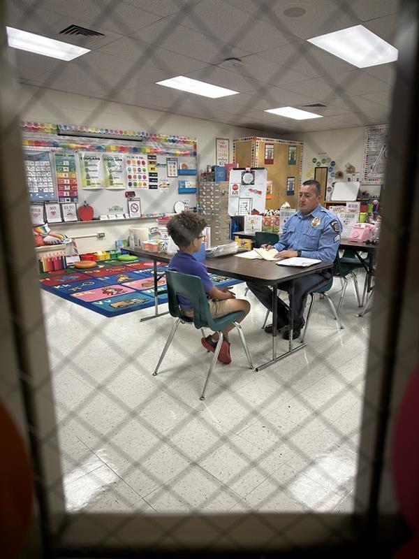 Kid interviewing with Sgt. Balli.
