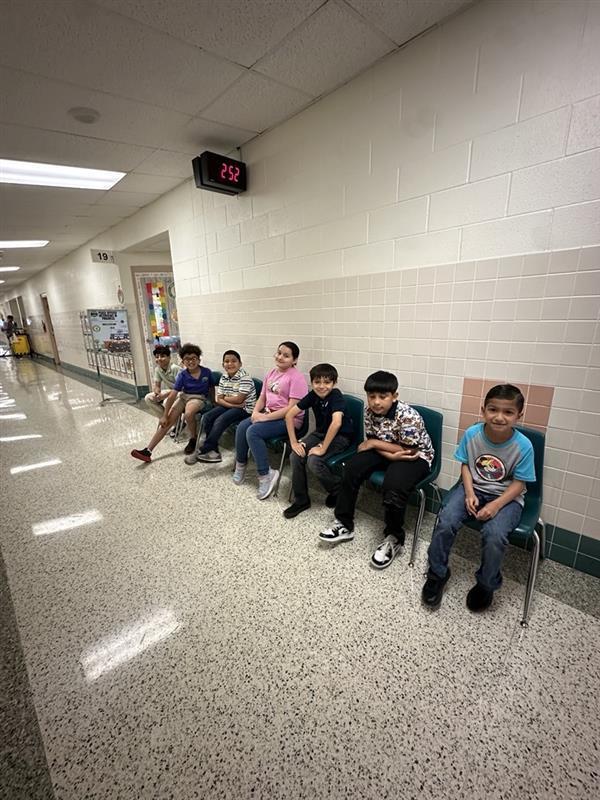 Kids posing waiting for interview.