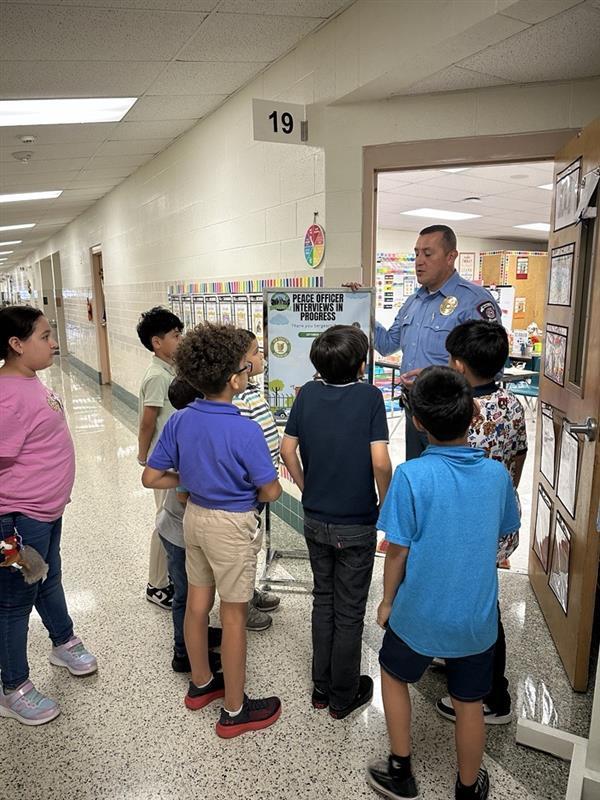 Sgt. Balli talking to kids.