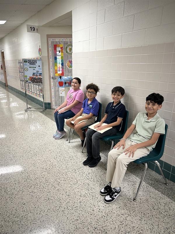 Kids posing waiting for interview.