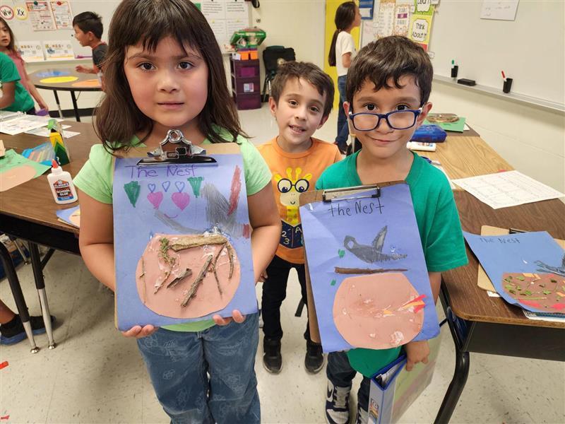 Kids posing with their nest.