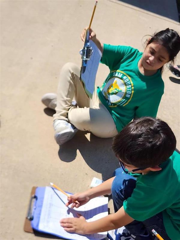 Students completing scavenger hunt activity.