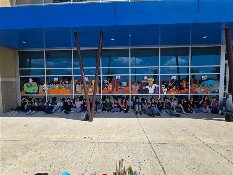 Fossum Visual Art students stand in front of the Scooby Doo themed mural they painted