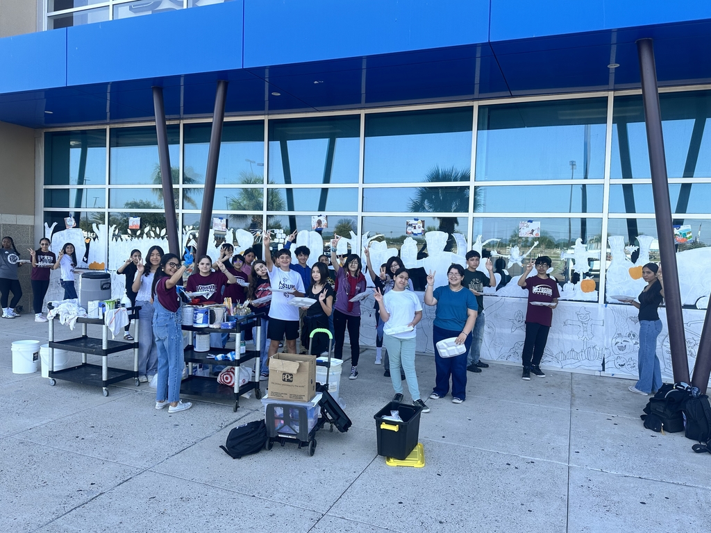 Fossum Visual Art students stand in front of the Scooby Doo themed mural they painted