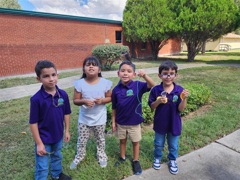 Kids posing outdoors.