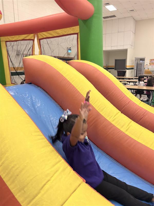 Student sliding.
