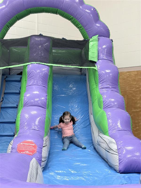 Student sliding.