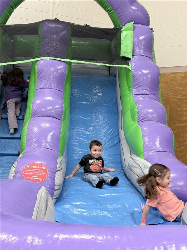 Students sliding.