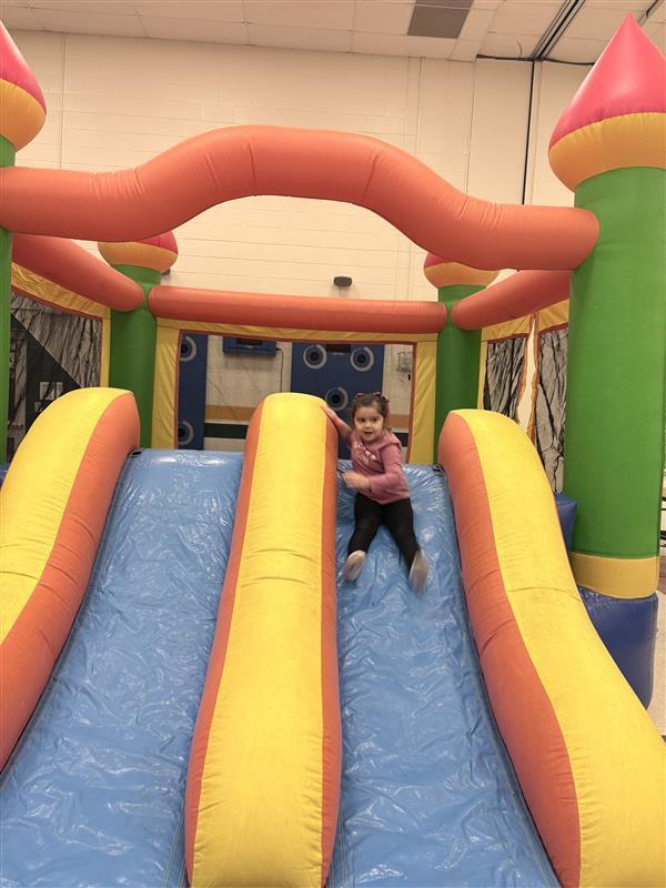 Student sliding.