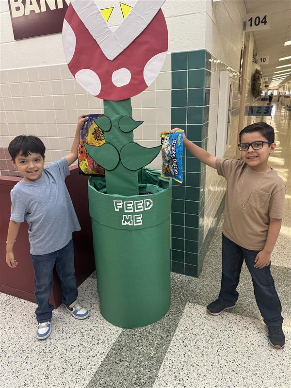 Students feeding the piranha plant.