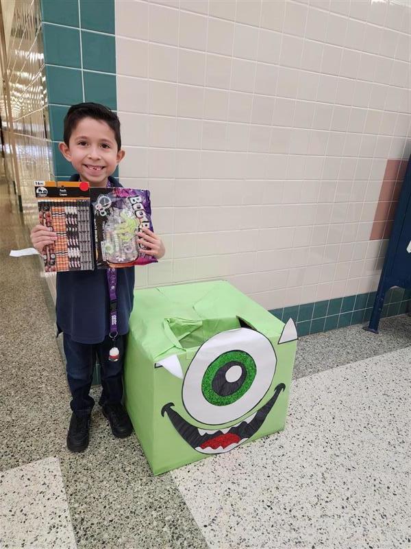 Student feeding the hungry monsters.