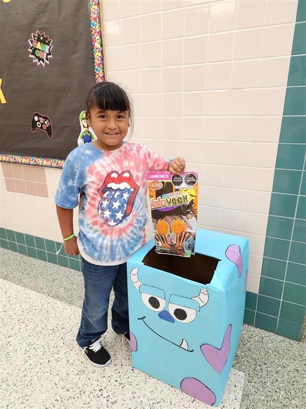 Student feeding the hungry monsters.