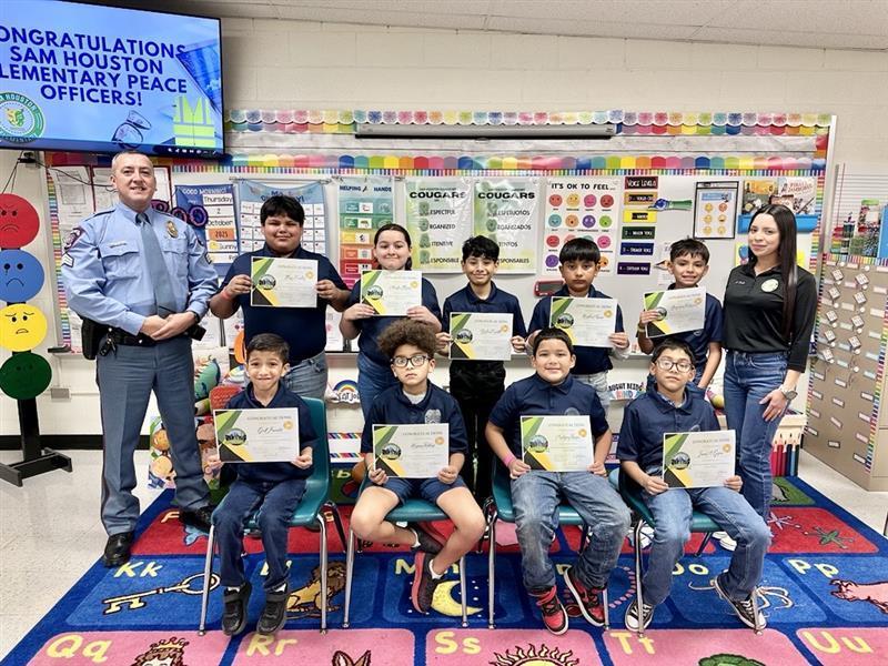Houstonville Peace Officers posing with certificates.