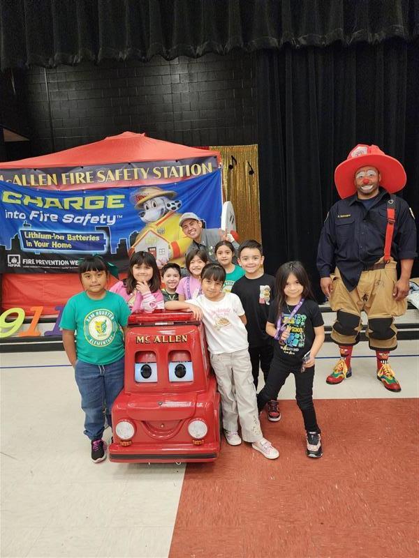 Kids posing during fire safety week.