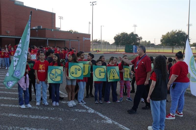 City council members pictured with COUGARS letters.