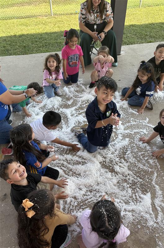 Students playing with snow.