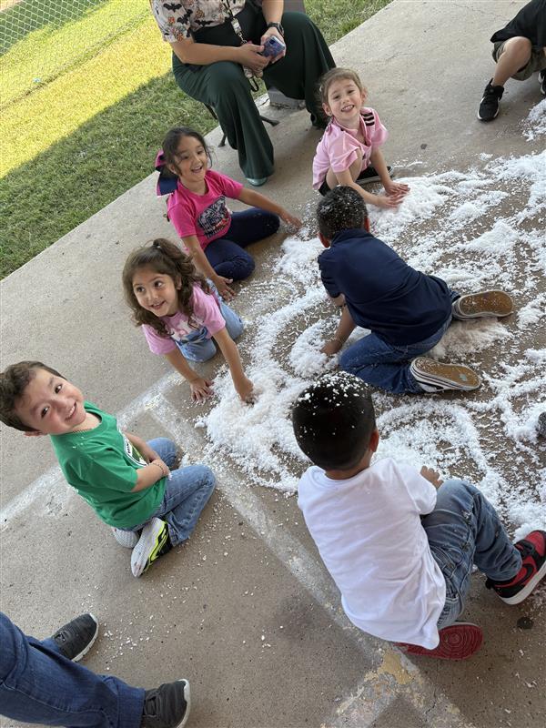 Students playing with snow.