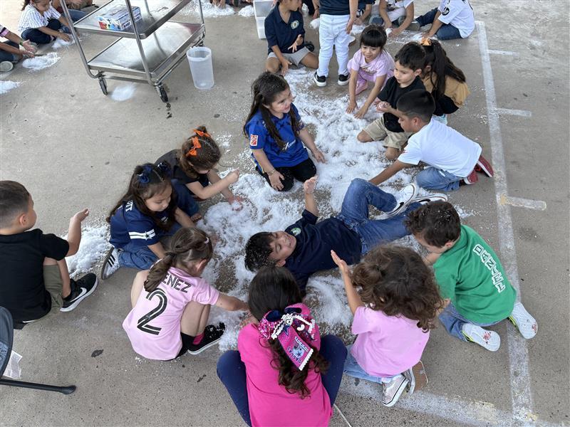 Students playing with snow.