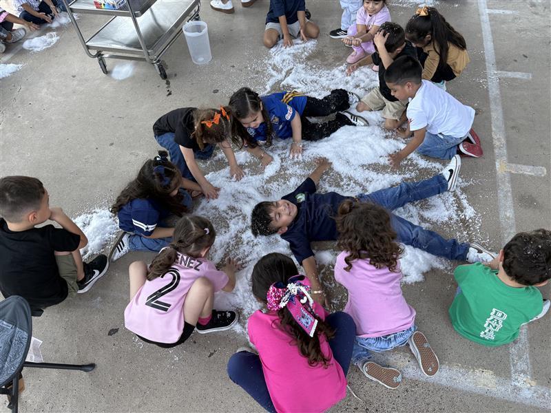 Students playing with snow.