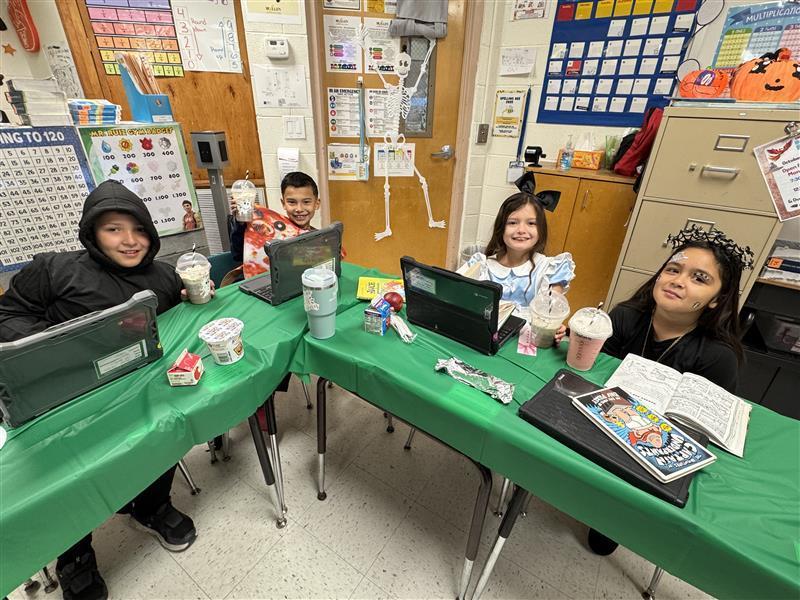 Students posing with treat.