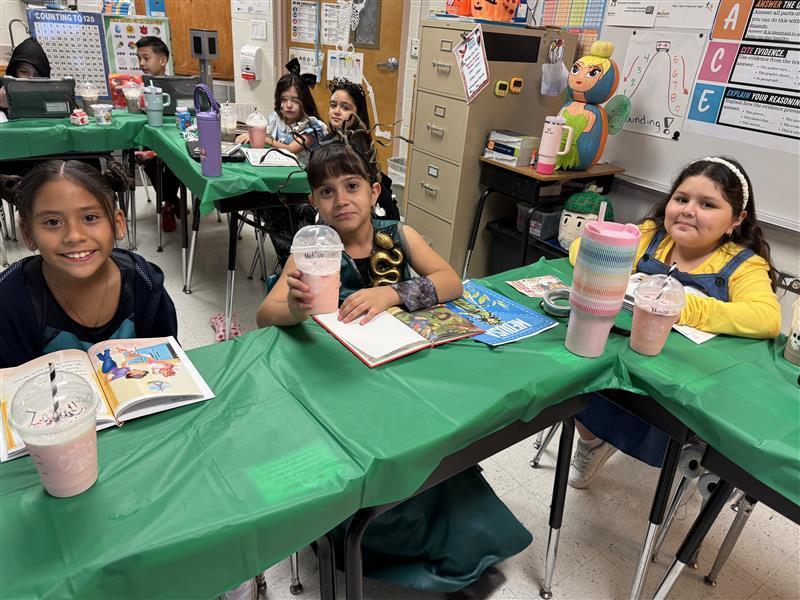 Students posing with treats.