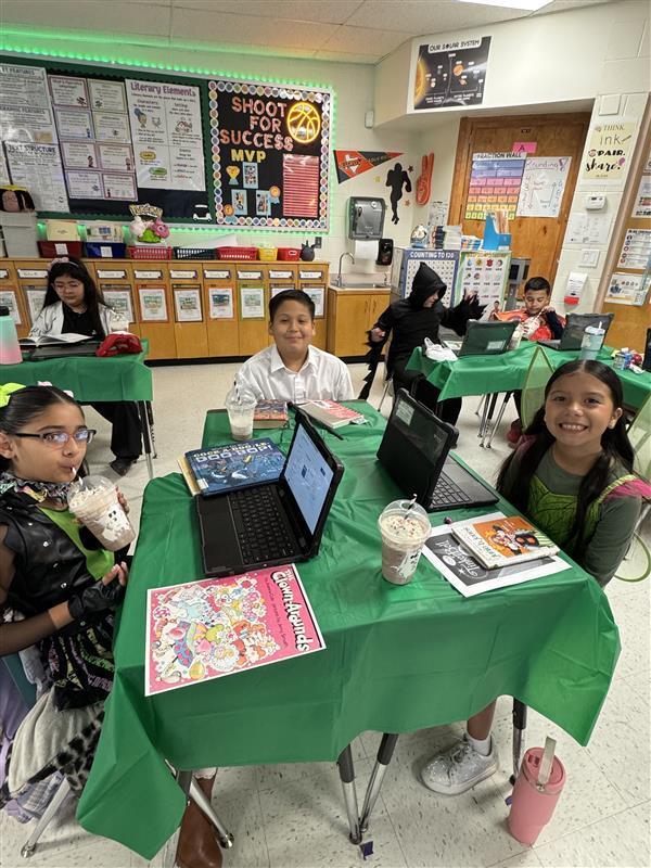 Students posing with treat.