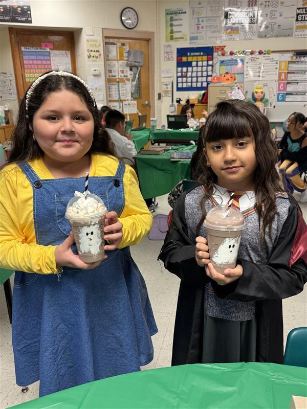 Students posing with treats.
