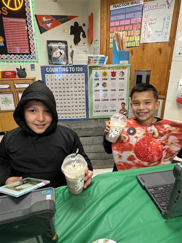 Students posing with treat.